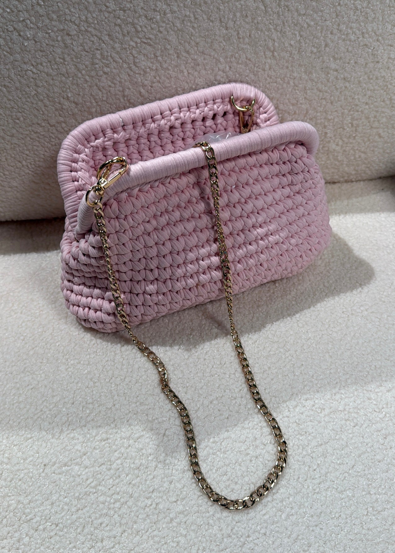 Clutch intrecciata rosa
