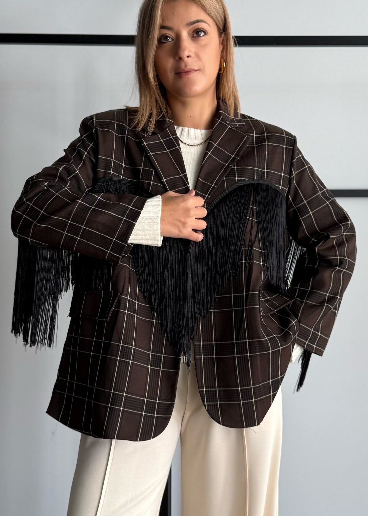 Blazer a quadri con frange nere
