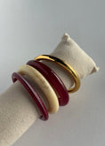 Carica l'immagine nel visualizzatore della galleria, Set bracciali rigidi effetto resina e metallo
