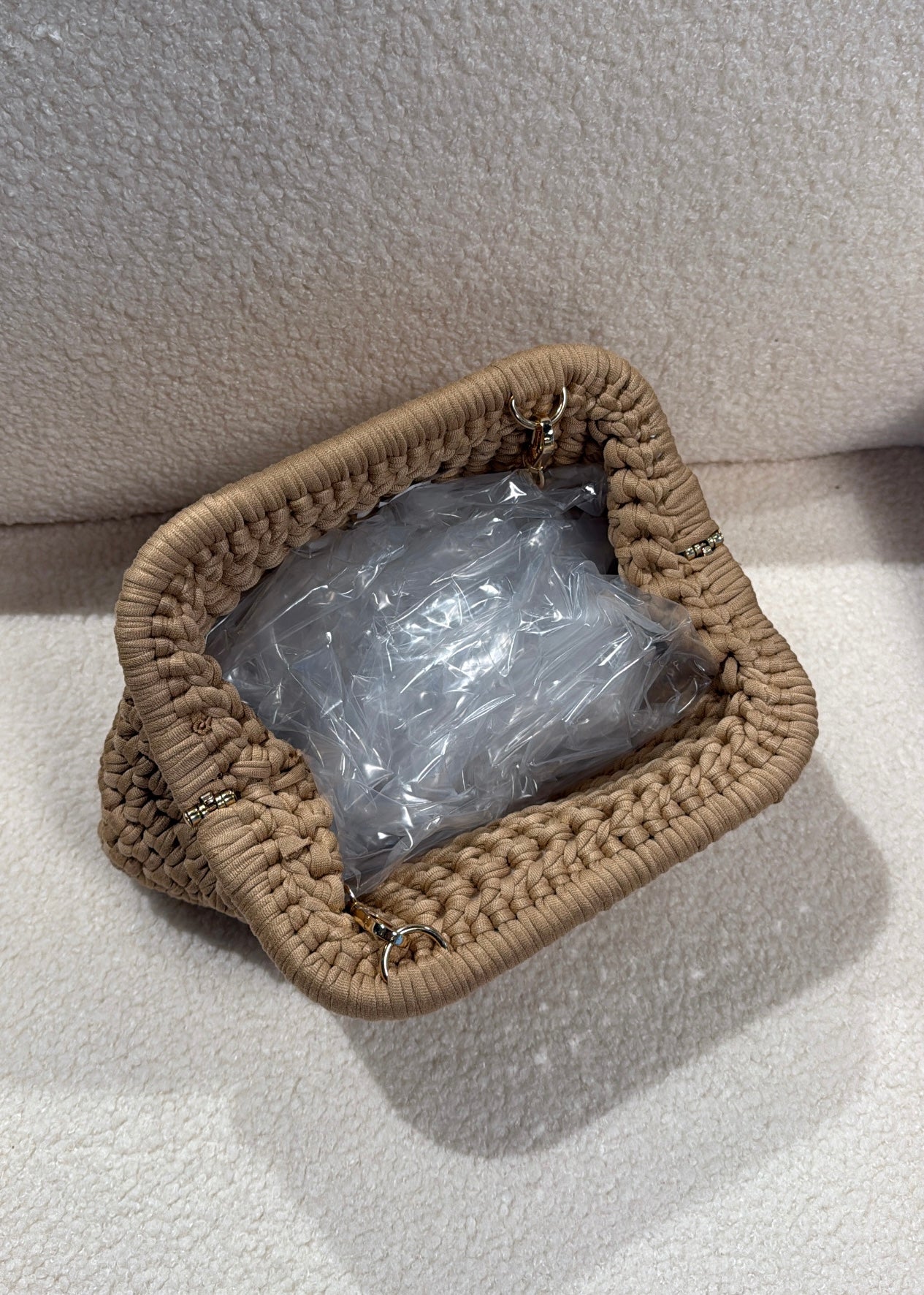 Clutch intrecciata beige