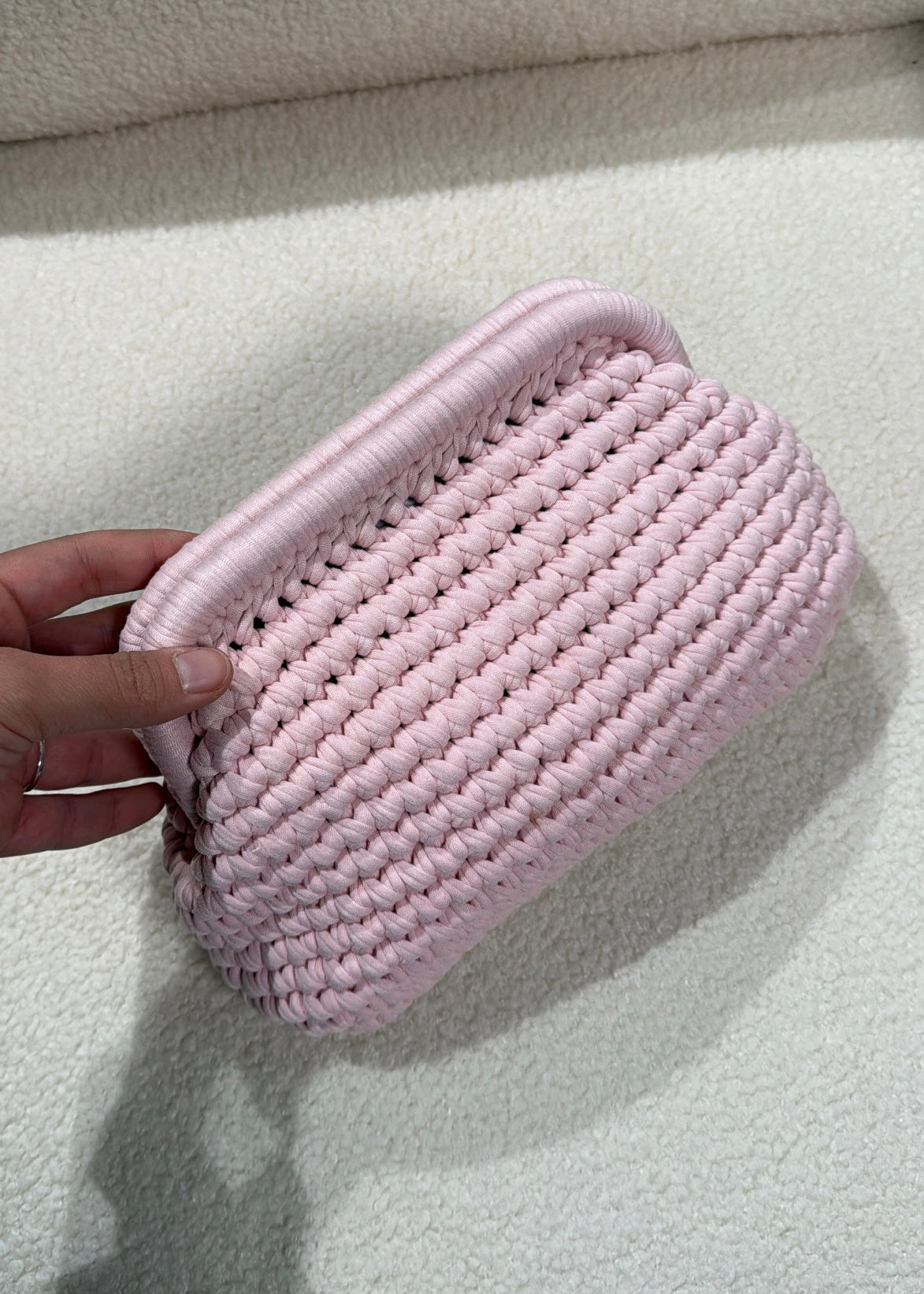 Clutch intrecciata rosa